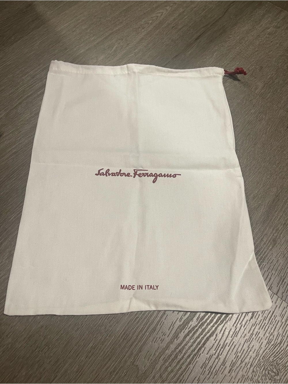 Salvatore Ferragamo white dust bag with burgundy logo